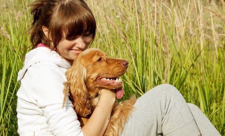 Woman With Golden Cocker Retriever